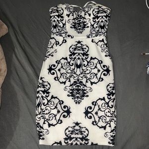 Womens strapless white and black dress with slight stains at the bottom